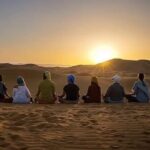 together in the dunes camel trekking sahara Morocco