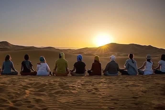 together in the dunes camel trekking sahara Morocco